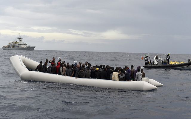 The Samuel Beckett, in the distance, prepares to rescue migrants in November of la