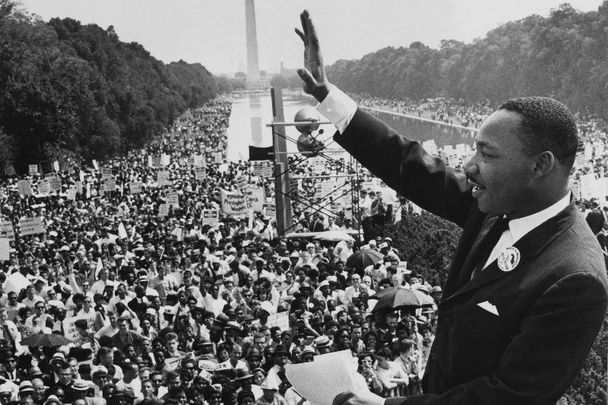 August 28, 1963: American minister and civil rights leader Dr Martin Luther King Jr waves to the crowd of more than 200,000 people gathered on the Mall after delivering his \'I Have a Dream\' speech at the March on Washington for Jobs and Freedom, Washington DC.