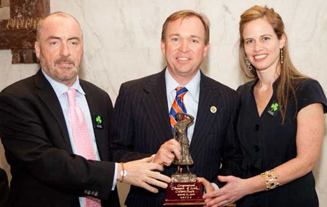 South Carolina Congressman Mick Mulvaney accepts the \"Congressional Champion of Irish Culture Award\" in 2014 from Irish Lobby for Immigration Reform Chairman Ciaran Staunton and U.S. Council on Irish Immigration President Margo Gaine.