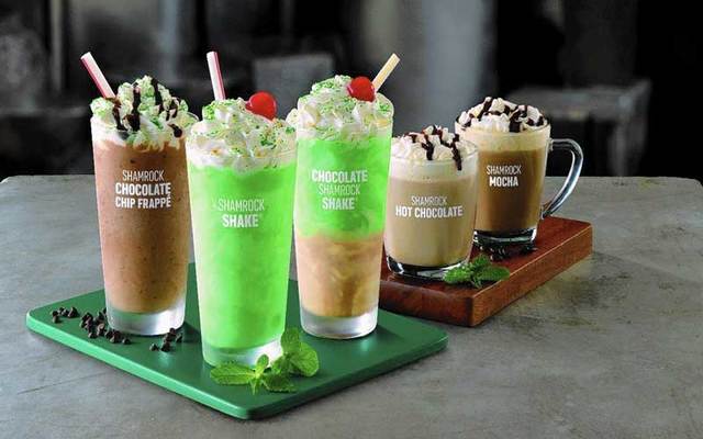 McDonalds is rolling out four new varieties of their seasonal shake this year: Shamrock Chocolate Chip Frappe, at left; Chocolate Shamrock Shake, third from left; Shamrock Mocha, at right; and Shamrock Hot Chocolate, second from right. The Original green, mint-flavored shake is second from left.
