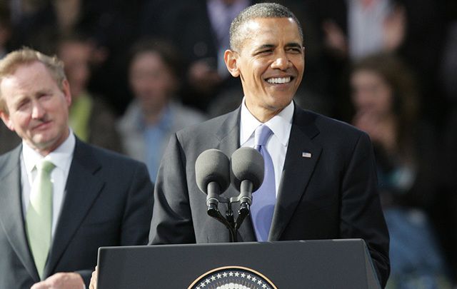 Barack Obama (right) and Enda Kenny stand before the crowds in Dublin in 2011. \n