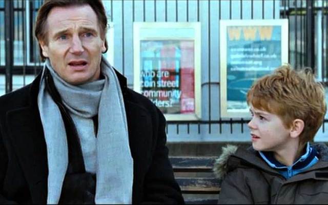 Screenshot of Liam Neeson with Thomas Brodie-Sangster in the 2003 hit movie ‘Love Actually.’