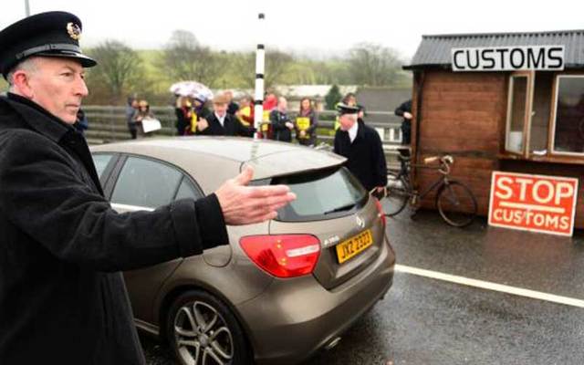 Protesters set up a mock checkpoint at the border between the Republic of Ireland and Northern Ireland on Saturday to show the potential impact of post-Brexit customs measures.