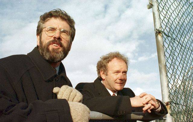 April 10, 1998: Sinn Fein President Gerry Adams with Chief Negotiator Martin McGuinness look over the wire in Stormont Castle after putting their final approval to the Good Friday Agreement. 