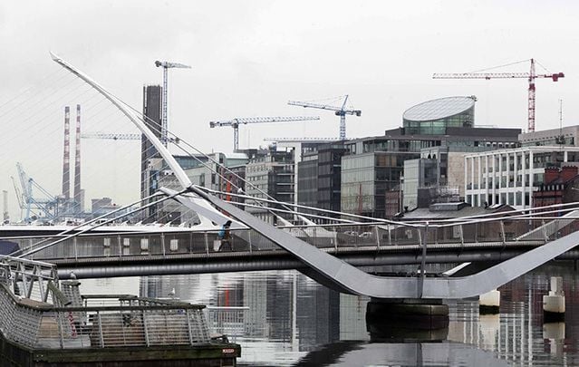 Construction cranes on the Quays in Dublin City in January.  