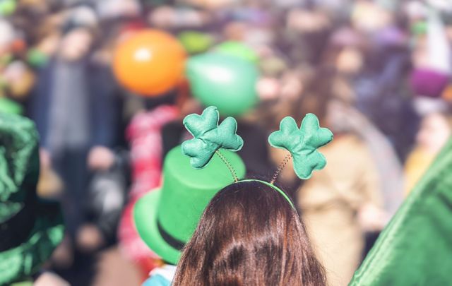 Spectators enjoying St. Patrick\'s Day celebrations.