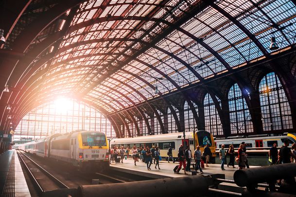 Trains and people boarding in the beautiful Antwerpen trainstation in Belgium.jpg