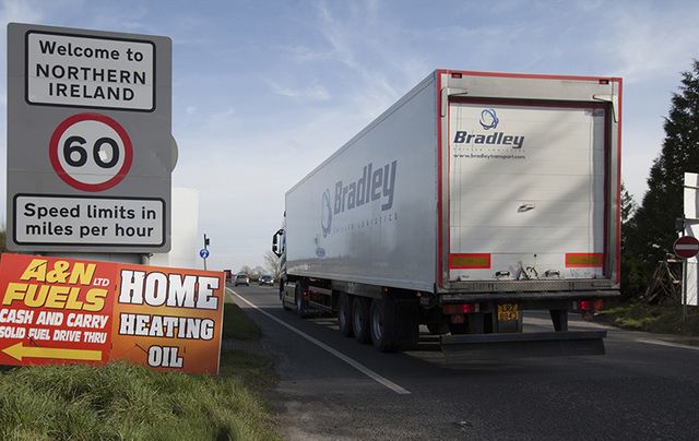 Commercial traffic from the Irish Republic passes an anti-Brexit sign last Friday, just inside the Northern Ireland border.