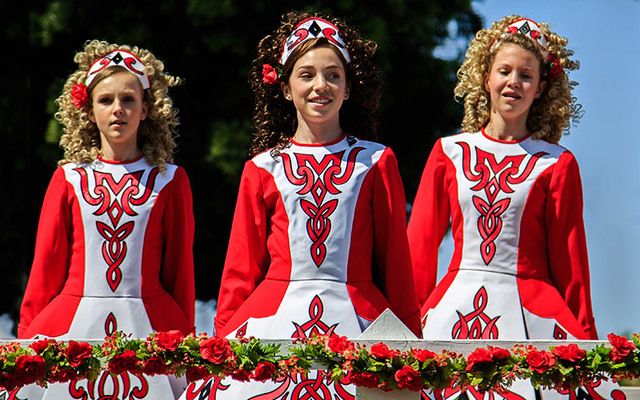 Irish dancers in red dresses.