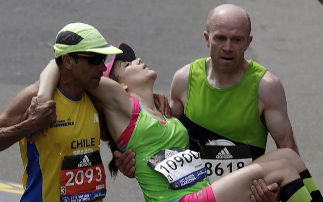 Terry Canning and Mario Vargas carried Julianne Bowe up to the line of the Boston Marathon. 