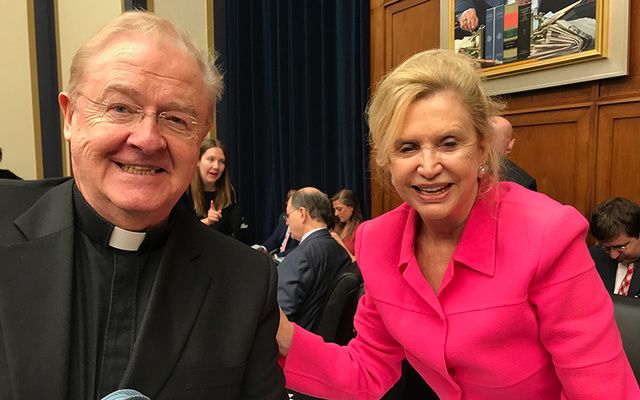 Congresswoman Carolyn Maloney and Fr. Sean McManus at one last week’s two meetings of the House Financial Services Committee.
