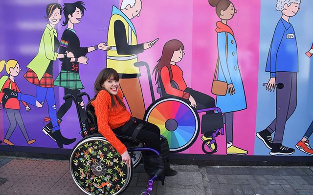 Isabel in front of a mural she\'s featured in by Chris Judge in the Dublin Docklands. 
