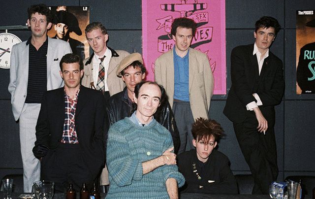 The Pogues, photographed with Irish DJ Fallon (front).