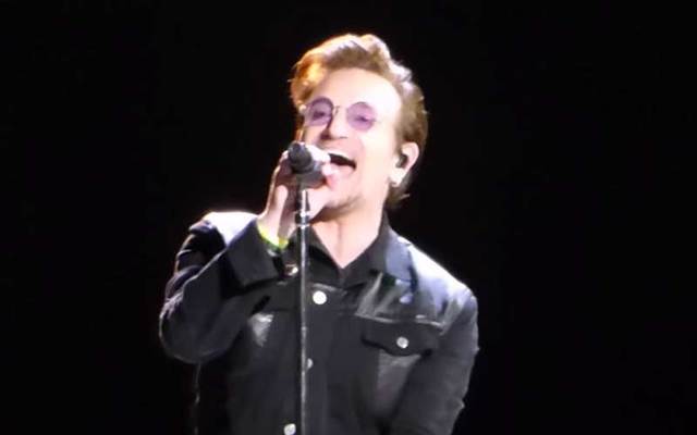 A snapshot of Bono singing during the opening night concert of U2\'s The Joshua Tree 2017 tour in Vancouver.