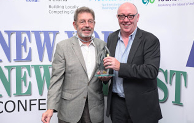 Oscar-winning Director and Belfast native Terry George (right) presents the Irish American of the Year Award to legendary author Pete Hamill - whose parents hailed from Belfast — at the 2012 New York-New Belfast Conference