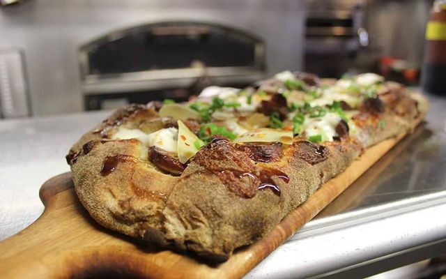 Tony Gemignani\'s sausage and stout pizza.