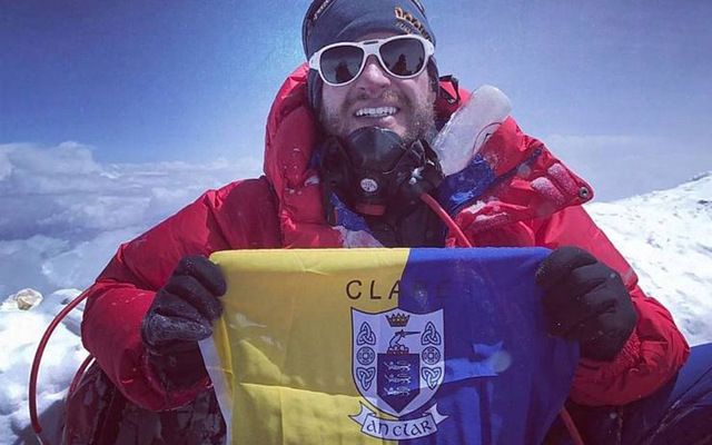 John Burke on the top of Mount Everest with the Clare flag. 