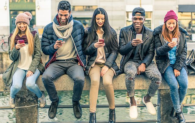 Together but absent: Eyes down, mesmerized by their phones. 