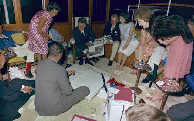 President John F. Kennedy opening birthday presents aboard the Sequoia in 1963.