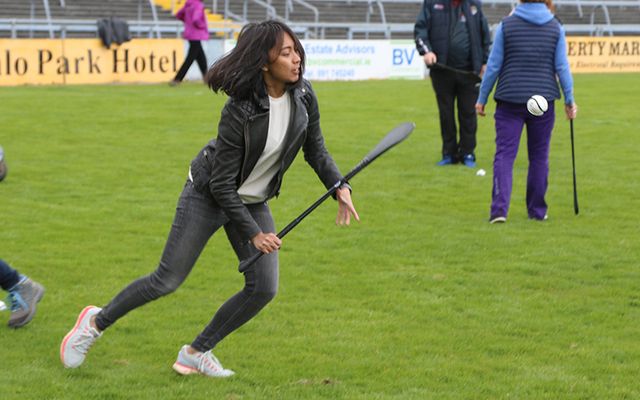 An international delegate learns some hurling skills at Pearse Stadium as part of the 2017 Climate Change, Agriculture and Food Security Conference in Galway. 