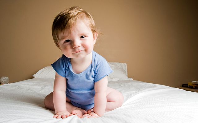 A baby boy in blue. 