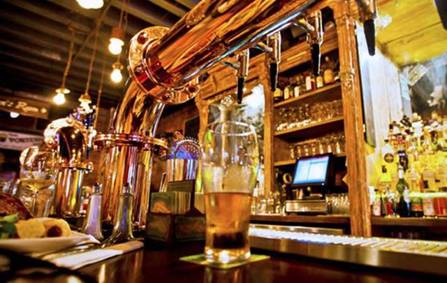 A glass of beer on a bar counter. The Irish pub is important to the country\'s economy, states a new report.