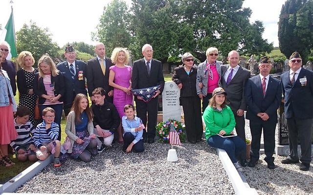 Michael Moffat's family and the American Legion at is newly erected headstone.