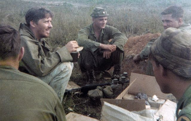 Chick Donohue, left, in Vietnam with his friends.