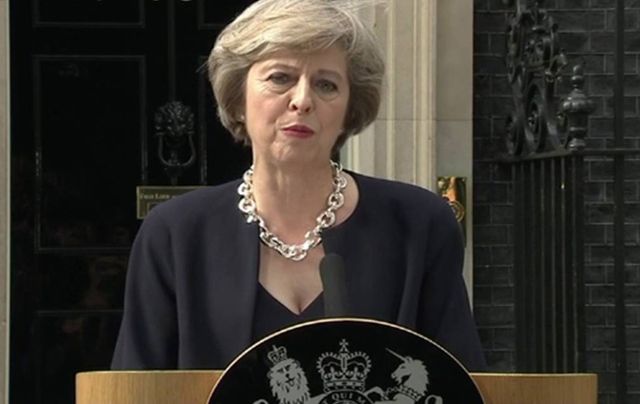 Conservative leader Theresa May addresses the press outside 10 Downing Street. \n