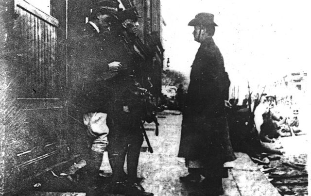 Patrick Pearse surrendering to General at the end of the Easter Rising.