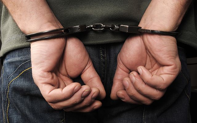 Man in handcuffs. 
