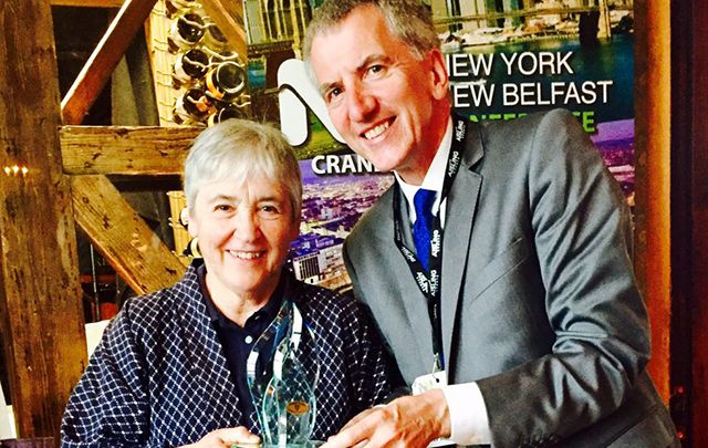 South Belfast Assembly Member and former Finance Minister for Northern Ireland Máirtín Ó Muilleoir presents Professor Maureen Murphy with her Irish American of the Year Award from the Irish Echo, given at the NYNB conference. 