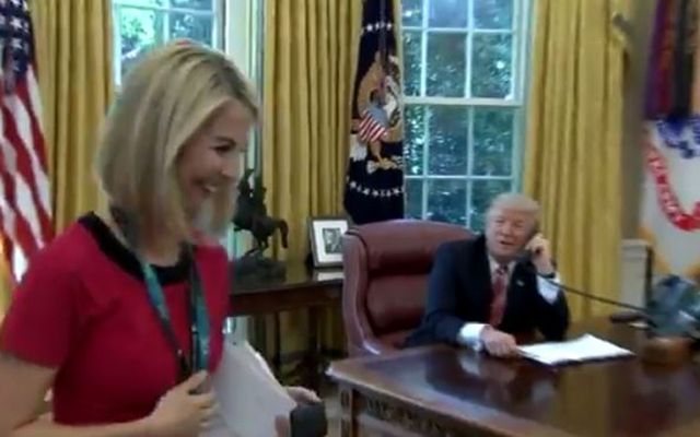 Trump called RTE\'s Catriona Perry over to his desk. 