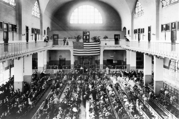 Immigrants arrive at Ellis Island.