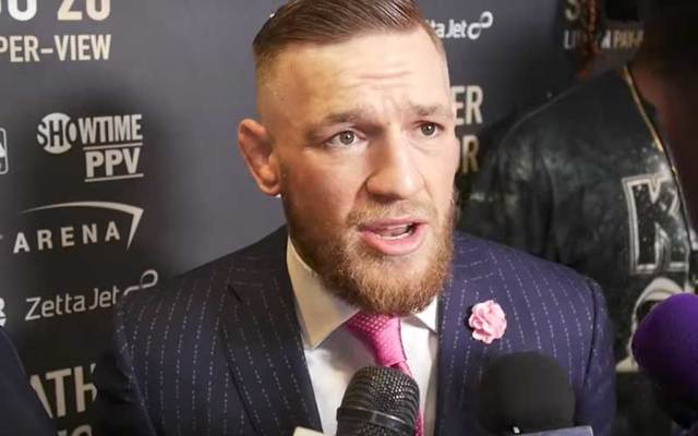 Conor McGregor wears his custom-made David August \'F*** You\' suit.