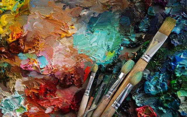 Paintbrushes and paint.