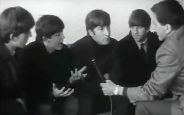 In this snapshot, The Beatles are interviewed by RTE's Frank Hall in Dublin.