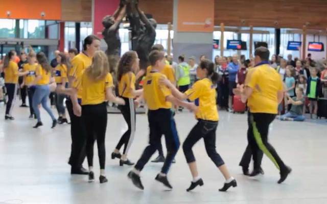 Young Irish flashmob dancers entertain travelers at Shannon Airport.