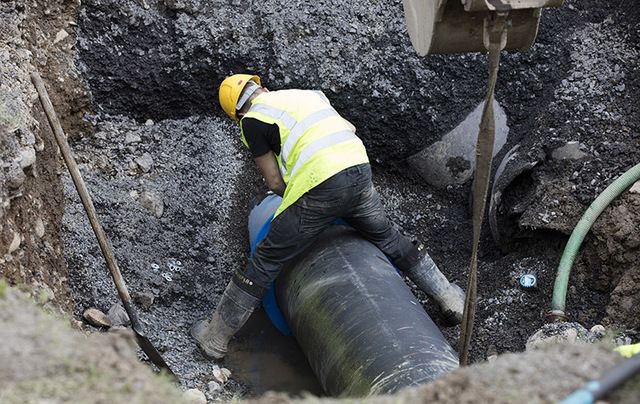 A worker repairs a burst water pipe in Navan, Co. Meath earlier this month – the second time the pipe burst.