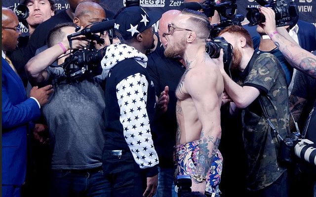 Floyd Mayweather and Conor McGregor stare down from the Barclays Center in Brooklyn