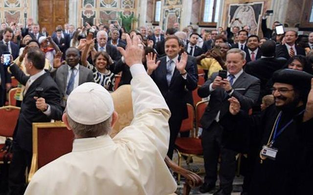 A delighted Sean Spicer takes a photo of Pope Francis. 