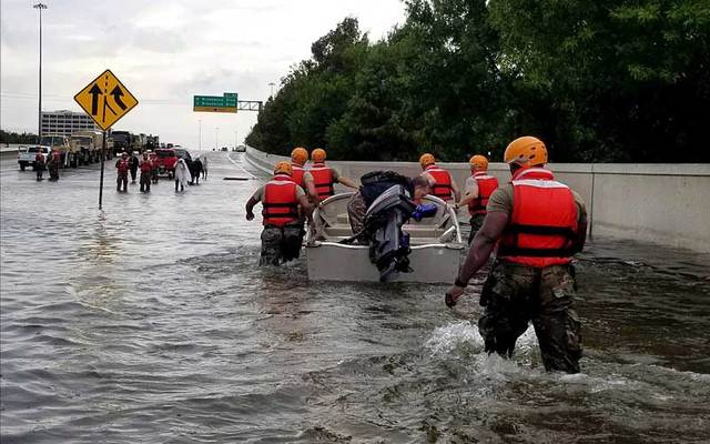 Texas Army National Guard move through Houston streets flooded from Hurricane Harvey on Monday, August 28, 2017. 