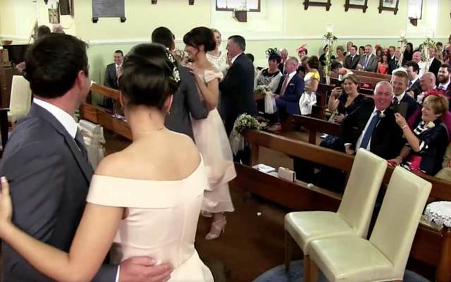  Irish wedding party couples dance in a church in Co. Galway.