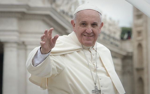 Pope Francis waving.