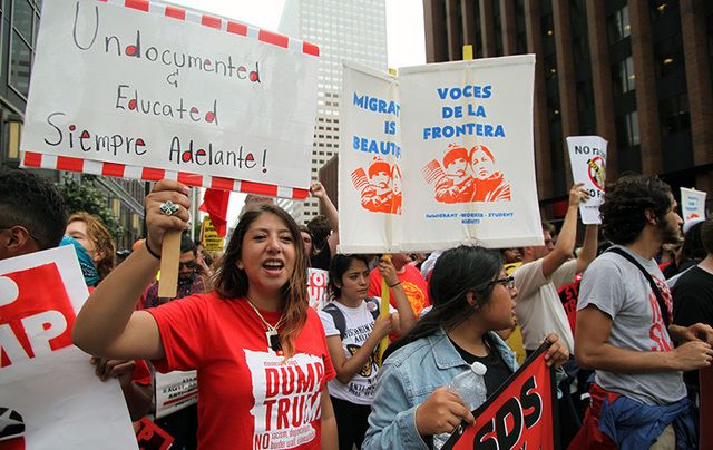 Young Hispanics support the Dream Act at the \'Stop Trump\' march on the first day of the Republican National Convention in 2016. 