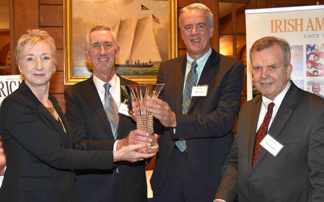 Patricia Harty, Steve Cutler, and Niall O'Dowd present Daniel O'Day with the 2017 House of Waterford Crystal Keynote Speaker Award