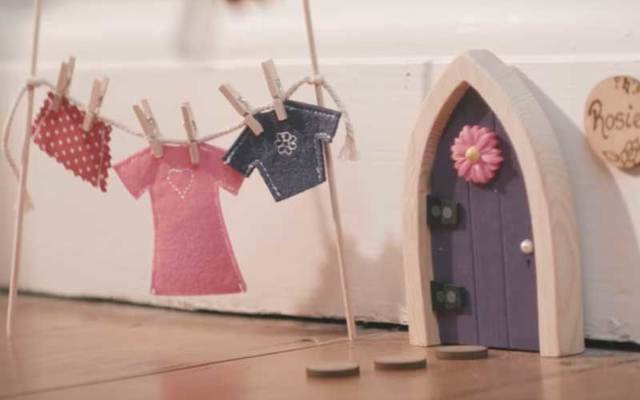 A screenshot of an Irish Fairy Door featured in a company advertisement on YouTube.
