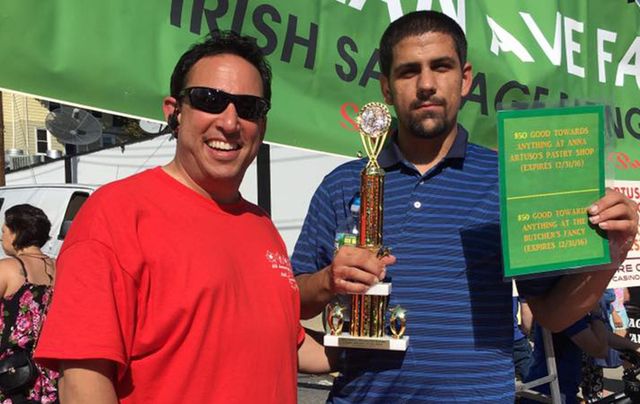 RJ Puma with the winner of last year’s cannoli eating contest.