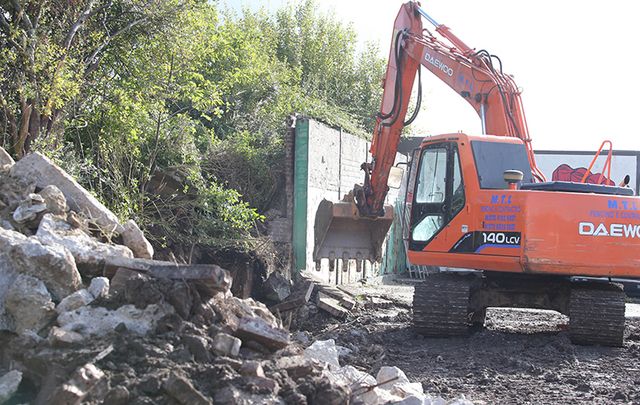 Work has started to remove a security wall that divides Springfield Road and Springhill Avenue. It was erected in 1989 as a security measure to provide extra protection to residents and the nearby New Barnsley police station. Transformation work on the site will include environmental improvements around the land next to two derelict houses and new community artwork.