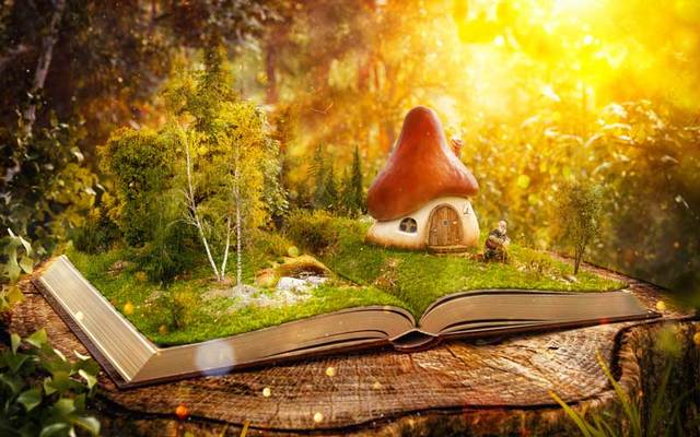 Mushroom fairy house scene in an open book.